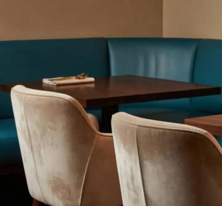 Interior details of Aussie Yum featuring beige and turquoise furnishings